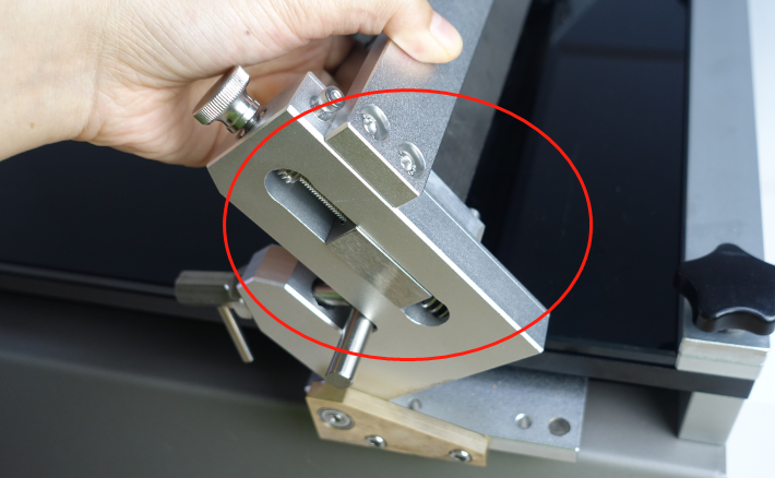 Film coating machine reversible scraper