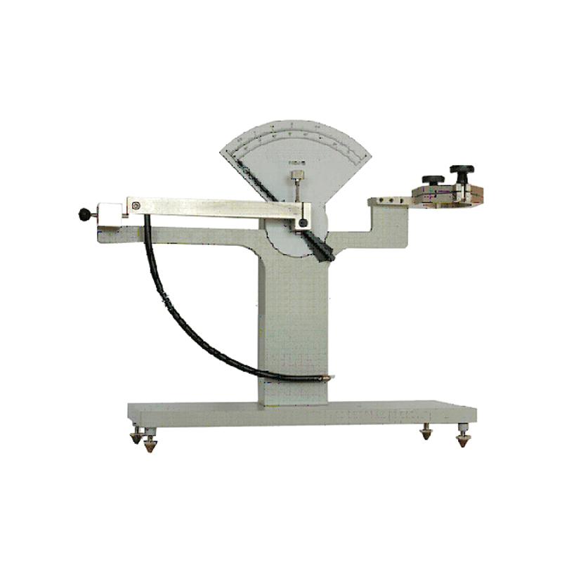 How does the pendulum impact Tester evaluate the mechanical properties of aluminum-coated paper in cigarette packs? Figure 1