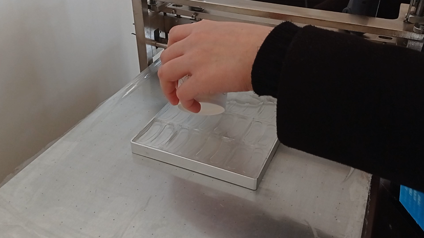 Scrape-coating of polymer materials on silicone molds for experimental small-scale coating machines